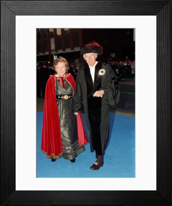 Framed Print : George Martin and wife Judy arriving at Elton Johns 50th birthday party