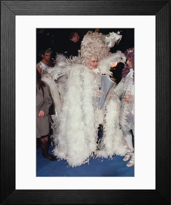 Framed Print : Elton John and David Furnish arriving at Eltons 50th birthday party at Hammersmith