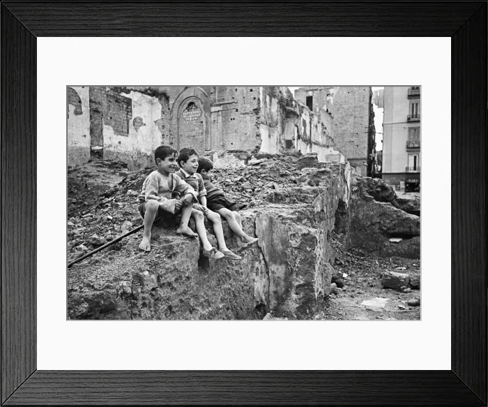 Framed Print : Scenes in Naples, southern Italy showing local children playing on a pile of rubble Framed Print : Scenes in Naples, southern Italy showing local children playing on a pile of rubble