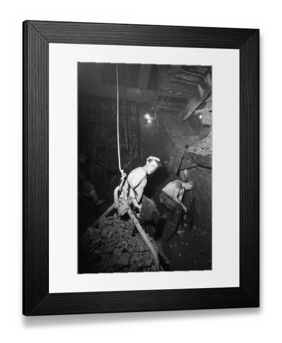 Framed Print : Construction workers digging the new Blackwall Tunnel in muddy and humid conditions