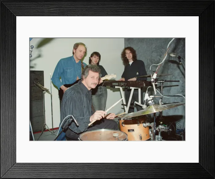 Framed Print : Pete Best, (in the black shirt holding his drum sticks) posing for the camera with his Framed Print : Pete Best, (in the black shirt holding his drum sticks) posing for the camera with his