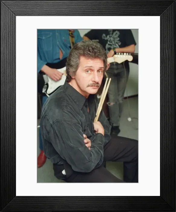Framed Print : Pete Best, (in the black shirt holding his drum sticks) posing for the camera with his