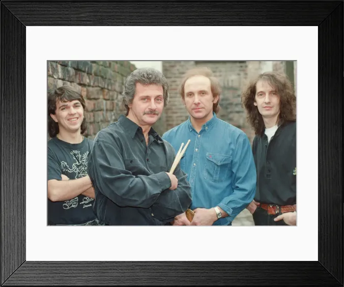Framed Print : Pete Best, (in the black shirt holding his drum sticks) posing for the camera with his Framed Print : Pete Best, (in the black shirt holding his drum sticks) posing for the camera with his
