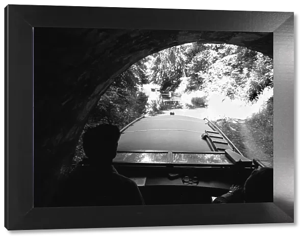 A small pleasure craft seen here emerging from the Chirk Tunnel on the Llangollen Canal