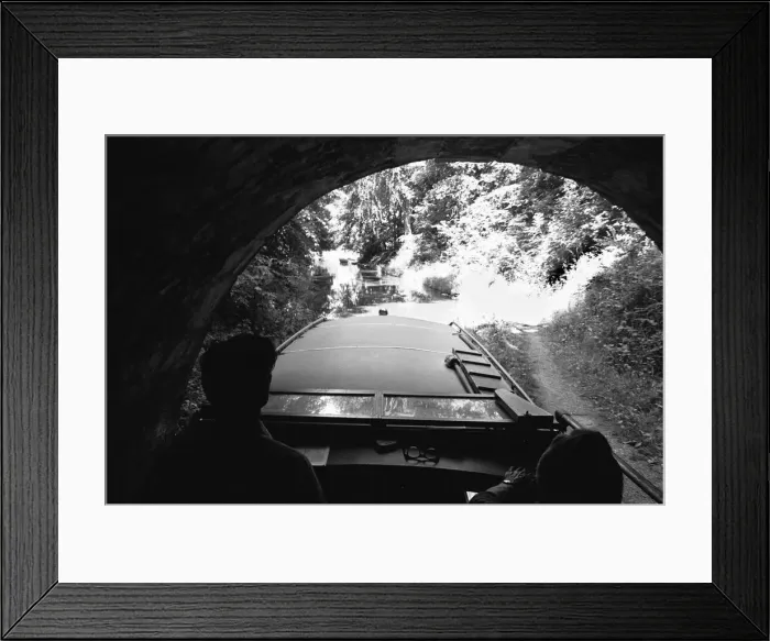 Framed Print : A small pleasure craft seen here emerging from the Chirk Tunnel on the Llangollen Canal