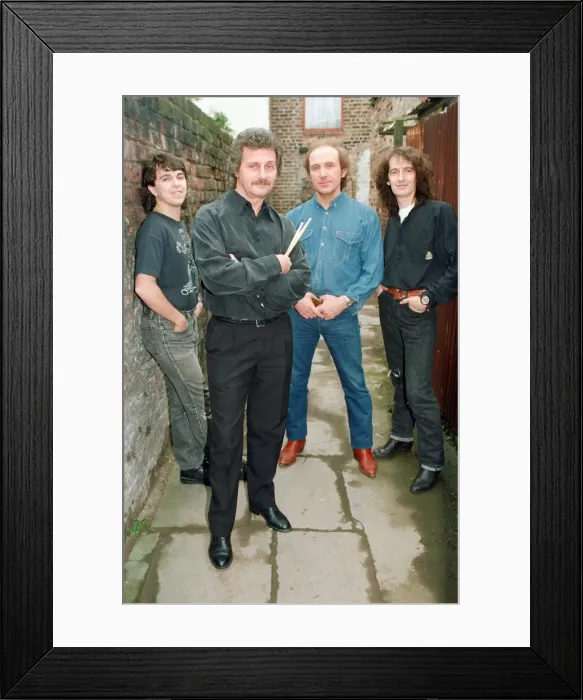Framed Print : Pete Best, (in the black shirt holding his drum sticks) posing for the camera with his Framed Print : Pete Best, (in the black shirt holding his drum sticks) posing for the camera with his
