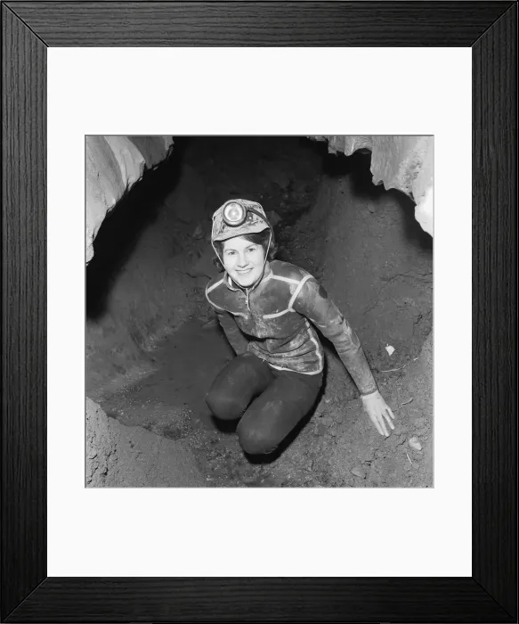 Framed Print : Eillen Davies seen here making her way thorough a series of caves under the Brecon Framed Print : Eillen Davies seen here making her way thorough a series of caves under the Brecon