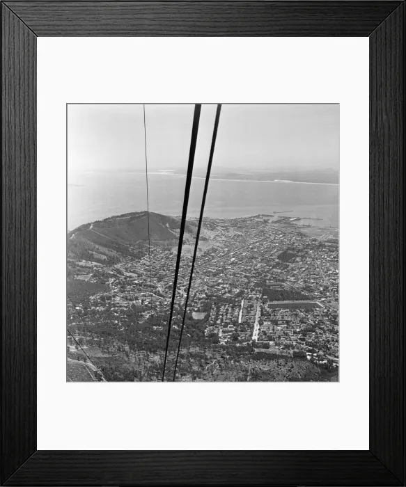 Framed Print : Cape Town seen from the cable car that takes tourists to the summit of Table Mountain Framed Print : Cape Town seen from the cable car that takes tourists to the summit of Table Mountain