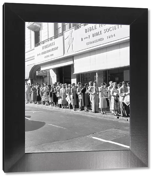 Whites only queue for a bus in Cape Town. 4th February 1955