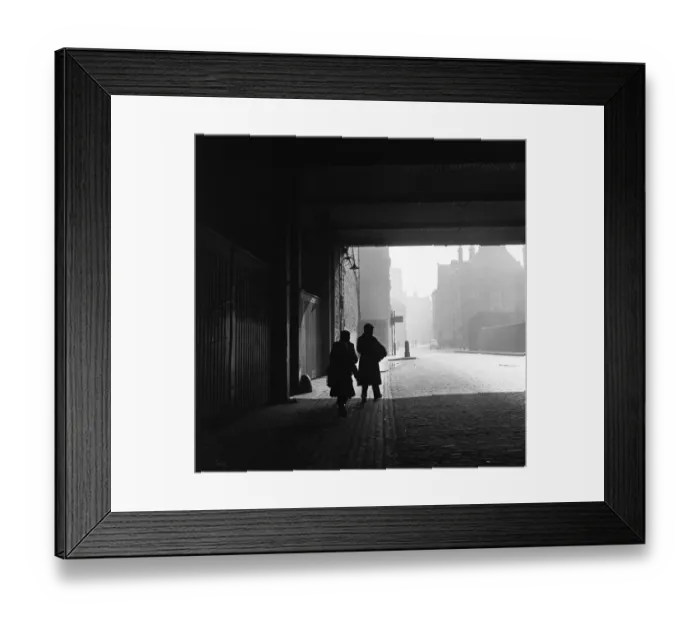Framed Print : A young family walks home with their purchases from the flea market at Club Row