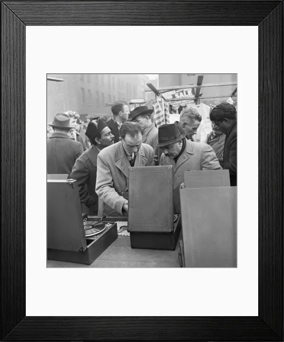 Framed Print : Customers at the secondhand gramophone stall at the flea market in Club Row Framed Print : Customers at the secondhand gramophone stall at the flea market in Club Row