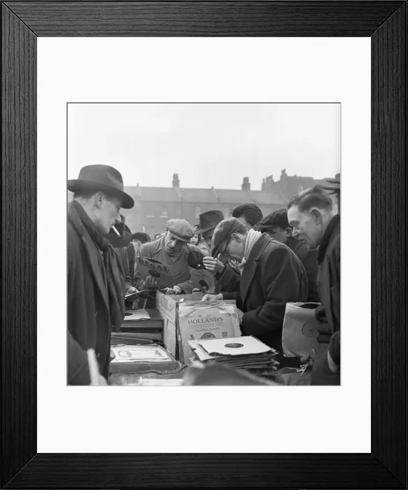 Framed Print : Customers at the secondhand gramophone record stall at the flea market in Club Row Framed Print : Customers at the secondhand gramophone record stall at the flea market in Club Row