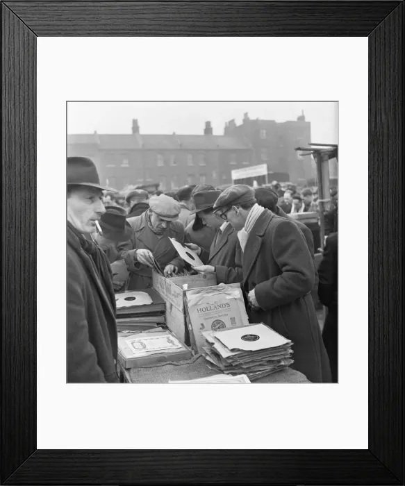 Framed Print : Customers at the secondhand gramophone record stall at the flea market in Club Row Framed Print : Customers at the secondhand gramophone record stall at the flea market in Club Row
