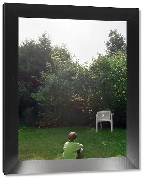 A child watching the solar eclipse indirectly at Hightown. 11th August 1999