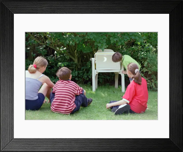 Framed Print : Children watching the solar eclipse indirectly at Hightown. 11th August 1999 Framed Print : Children watching the solar eclipse indirectly at Hightown. 11th August 1999