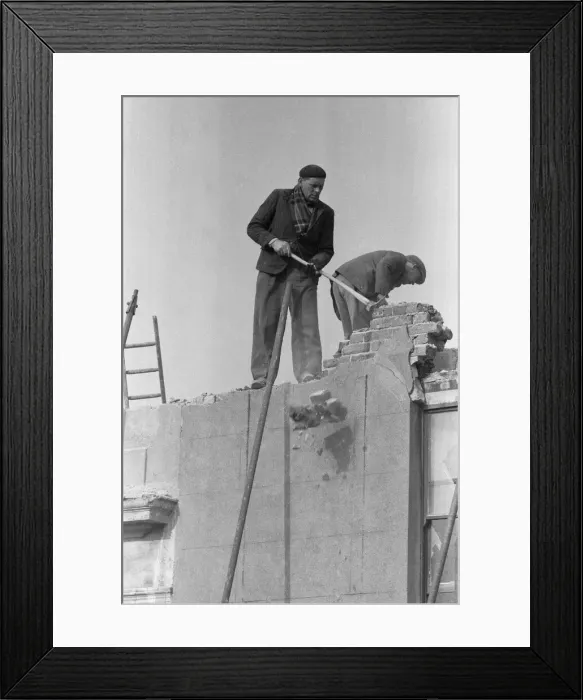 Framed Print : Clearing bomb damage buildings in Bromley by Bow. 3rd March 1955 Framed Print : Clearing bomb damage buildings in Bromley by Bow. 3rd March 1955