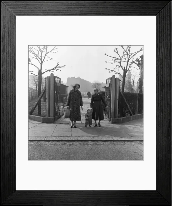 Framed Print : Mother, Grandmother and child seen here walking in an un-named East London Park