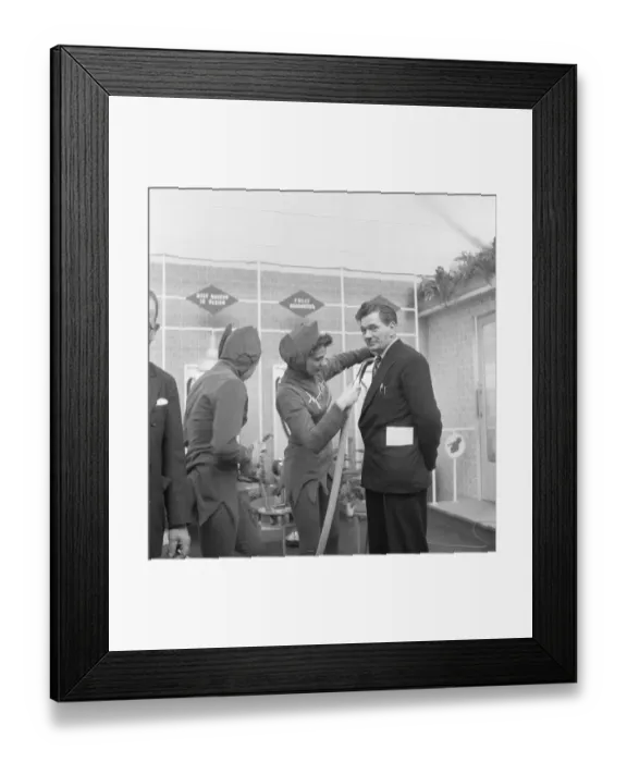 Framed Print : Ideal Home Exhibition Olympia. 3rd March 1955 A journalist is hoovered by a sales