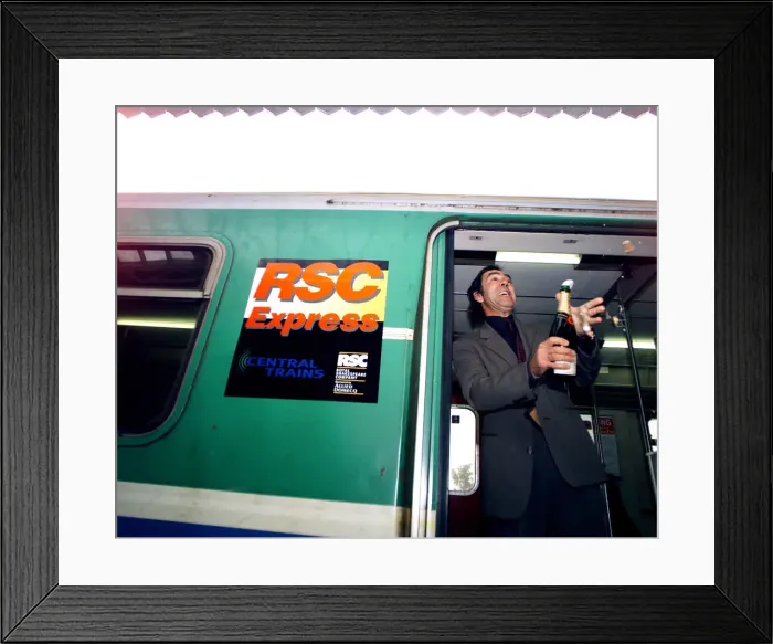 Framed Print : Actor Robert Lindsay toasts the new RSC Express at Stratford station Framed Print : Actor Robert Lindsay toasts the new RSC Express at Stratford station
