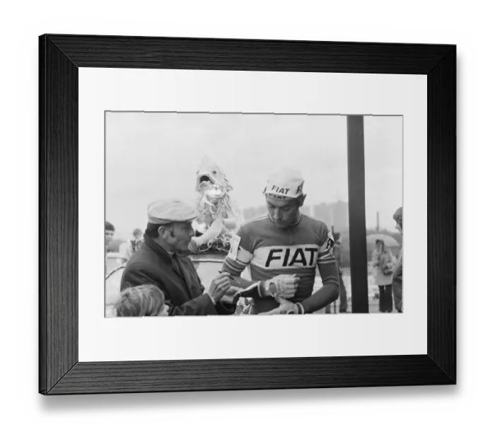 Framed Print : Eddy Merckx is asked to sign his autograph for a fan, as he attends Britains biggest