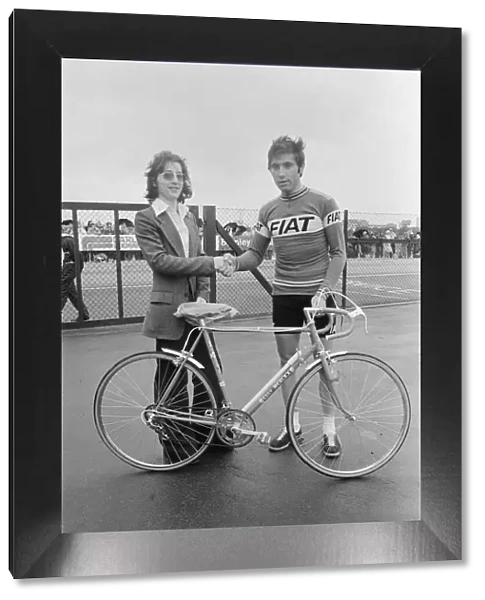 Eddy Merckx (right) presents n Eddy Merckx cycle to Daily Mirror competition winner