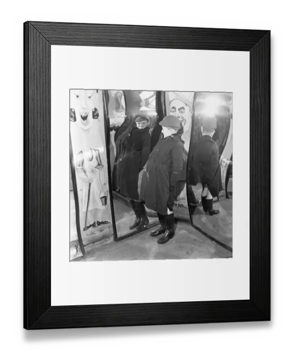 Framed Print : Little Peter MacNeil (10) has a laugh at himself in the distorted mirrors at the Louis Framed Print : Little Peter MacNeil (10) has a laugh at himself in the distorted mirrors at the Louis
