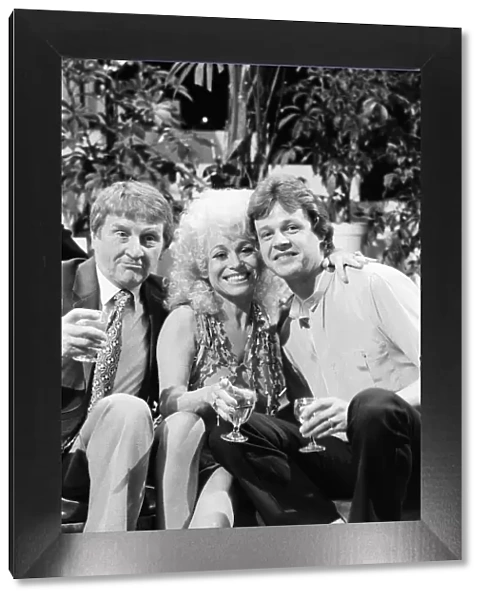 Norman Collier with Barbara Windsor and her boyfriend Stephen Hollings filming a TV show