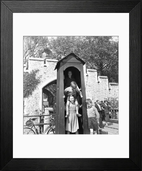 Framed Print : When the sentry is away the children will play. Children visiting The Tower of London Framed Print : When the sentry is away the children will play. Children visiting The Tower of London
