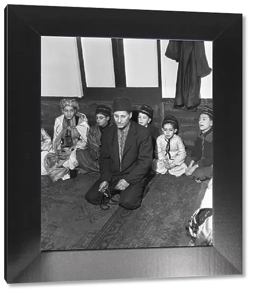 Children attend the Peel Street Mosque in Tiger Bay, Cardiff. 1st March 1954