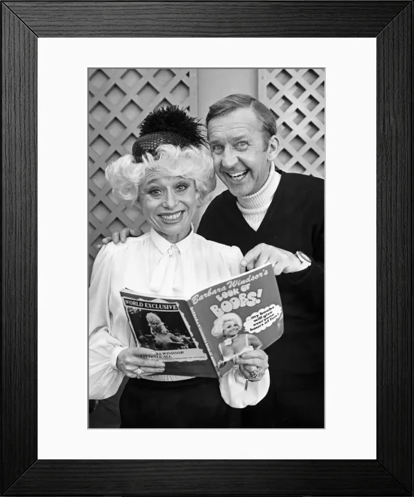 Framed Print : Comedian Norman Vaughan joints Barbara Windsor to look at her newly published book Framed Print : Comedian Norman Vaughan joints Barbara Windsor to look at her newly published book