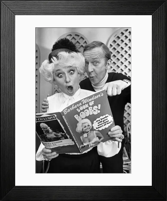 Framed Print : Comedian Norman Vaughan joints Barbara Windsor to look at her newly published book