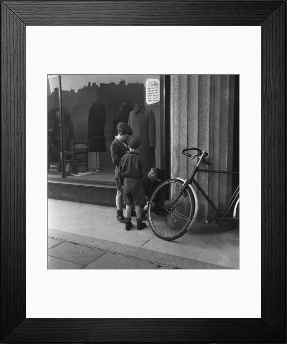 Framed Print : Boys outside a un-named clothing shop in the East End of London, 22nd February 1954 Framed Print : Boys outside a un-named clothing shop in the East End of London, 22nd February 1954