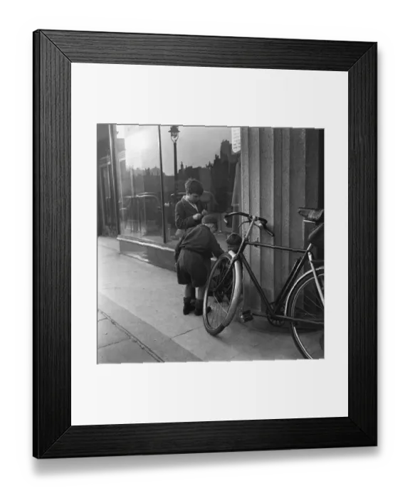 Framed Print : Boys outside a un-named clothing shop in the East End of London, 22nd February 1954