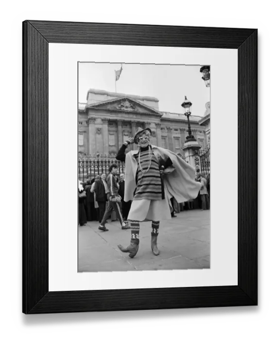 Framed Print : Barry Humphries in character as Dame Edna Everage outside Buckingham Palace, London