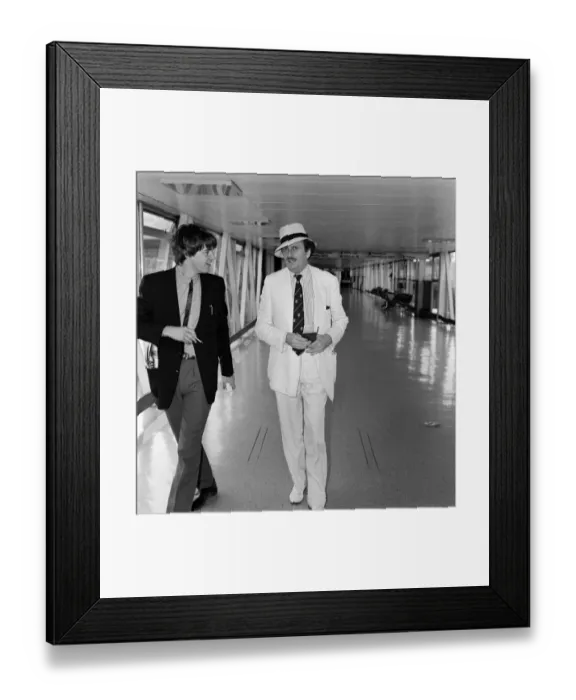 Framed Print : Barry Humphries leaving Heathrow Airport for New York. 10th August 1983