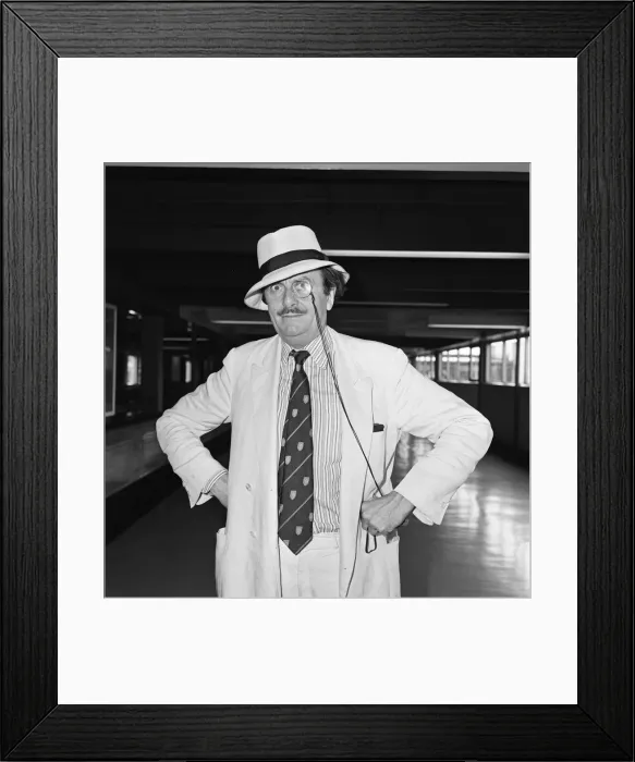 Framed Print : Barry Humphries leaving Heathrow Airport for New York. 10th August 1983 Framed Print : Barry Humphries leaving Heathrow Airport for New York. 10th August 1983