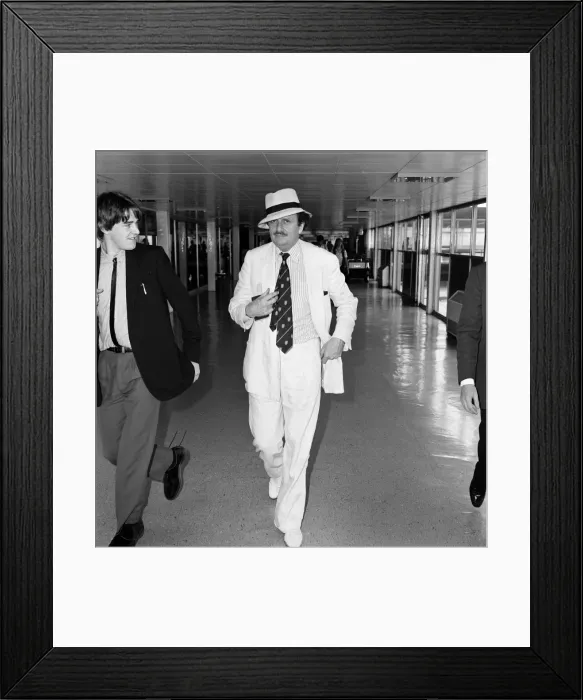 Framed Print : Barry Humphries leaving Heathrow Airport for New York. 10th August 1983 Framed Print : Barry Humphries leaving Heathrow Airport for New York. 10th August 1983