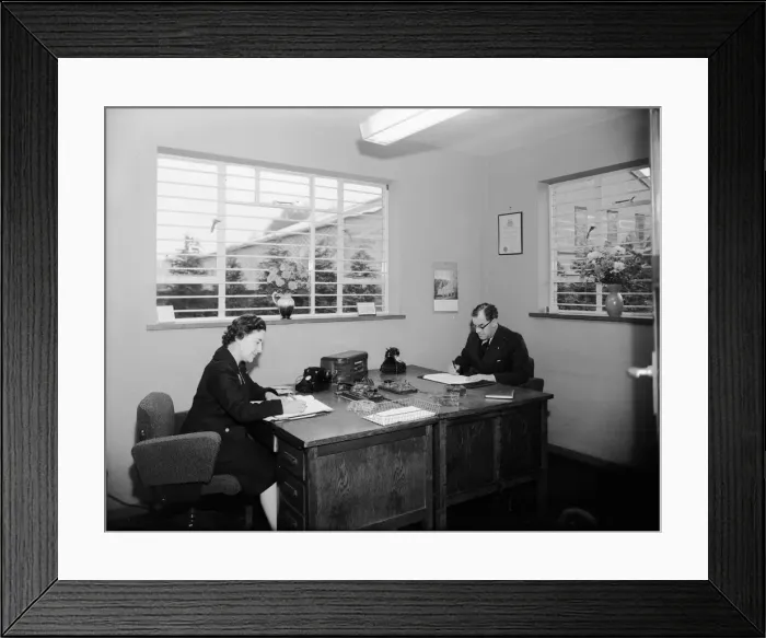 Framed Print : King and Hutchings accountants office, Mr Gadsby seen here with his secretary Framed Print : King and Hutchings accountants office, Mr Gadsby seen here with his secretary