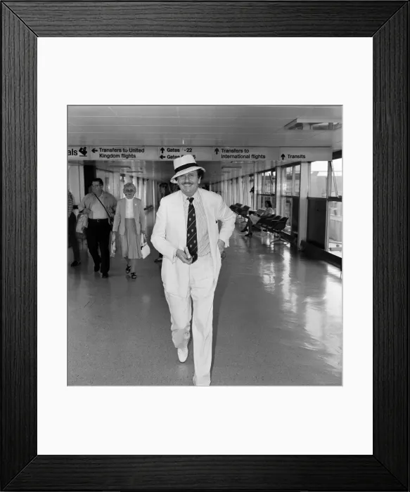 Framed Print : Barry Humphries leaving Heathrow Airport for New York. 10th August 1983 Framed Print : Barry Humphries leaving Heathrow Airport for New York. 10th August 1983