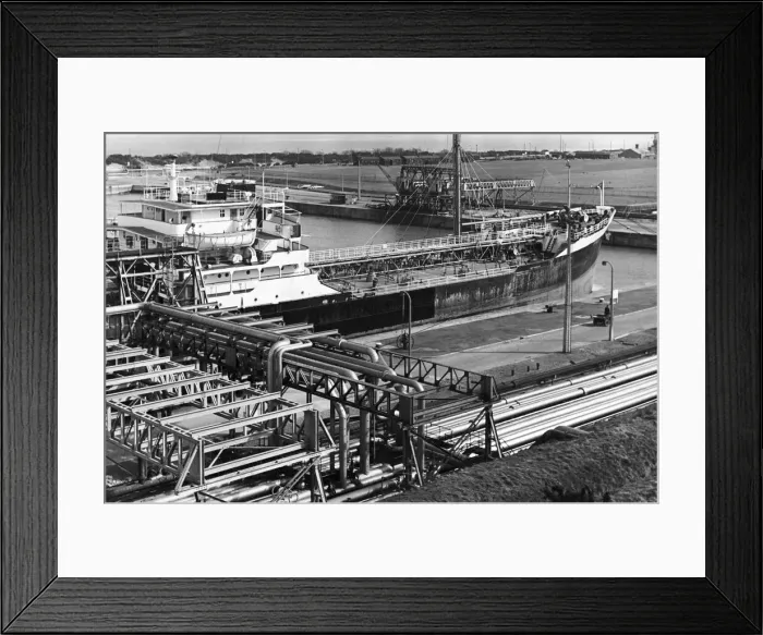 Framed Print : An oil tanker discharges oil at the quayside of the Queen Elizabeth II oil dock Framed Print : An oil tanker discharges oil at the quayside of the Queen Elizabeth II oil dock