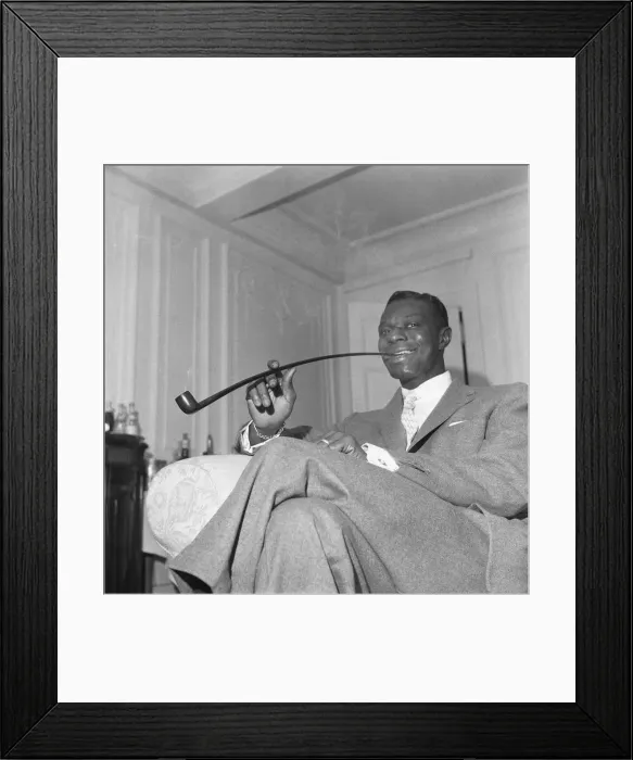 Framed Print : Singer and pipe collector Nat King Cole seen here with his Church Warden pipe in his Framed Print : Singer and pipe collector Nat King Cole seen here with his Church Warden pipe in his