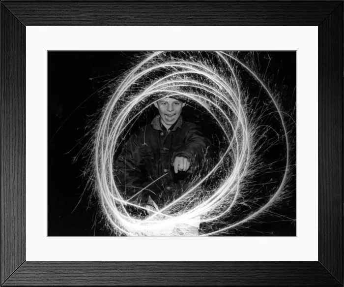 Framed Print : Dean Lokko of Rhyl has fun with sparklers on Bonfire night. 11th November 1993 Framed Print : Dean Lokko of Rhyl has fun with sparklers on Bonfire night. 11th November 1993
