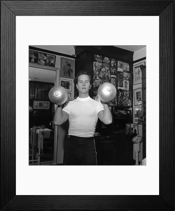 Framed Print : American singer, Pat Boone, exercises for his part in his next film Framed Print : American singer, Pat Boone, exercises for his part in his next film