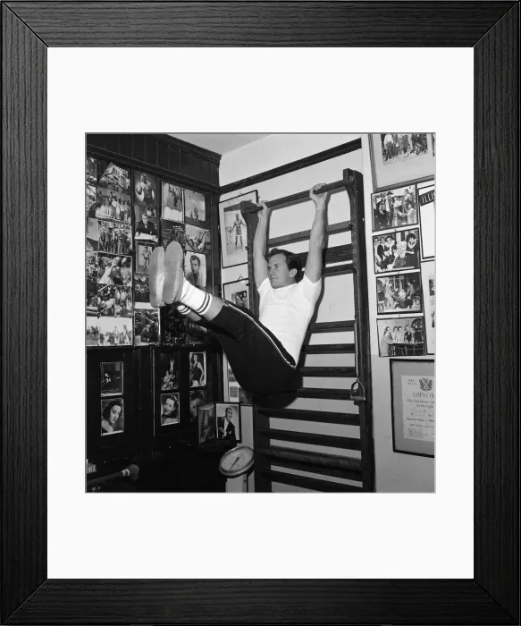 Framed Print : American singer, Pat Boone, exercises for his part in his next film