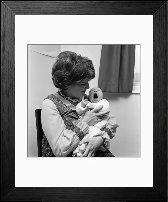 Framed Print : Actress Anne Reid at home in Manchester with her newborn baby son. 23rd November 1971
