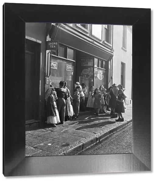 Arab children gather outside a general store on their way to attend the Peel Street