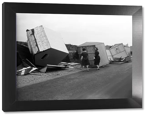 Beach huts wreaked at Littlehampton, West Sussex. 29th July 1956