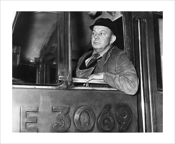 Train driver Tommy Heywood in the cab of his British Rail express Class 85 electric