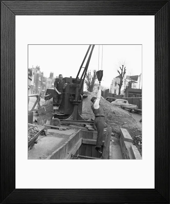 Framed Print : Letting the boss down. Up on the hills of Hampstead Green a sewer is being relined Framed Print : Letting the boss down. Up on the hills of Hampstead Green a sewer is being relined