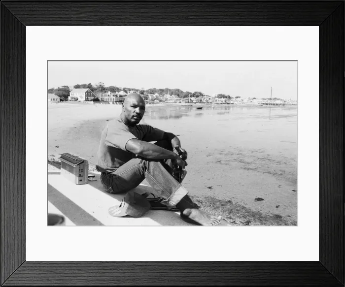 Framed Print : American boxer Marvin Hagler relaxes with a flute ahead of his title challenge against
